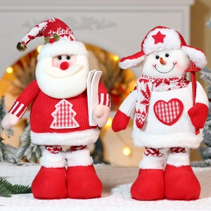 Detailed knit texture of Santa and Snowman plush dolls with skiing gear in a cozy setting