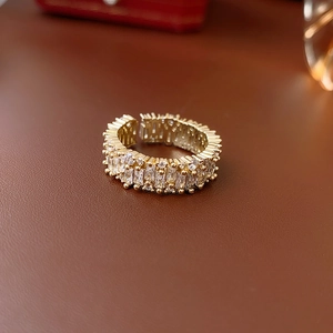 Detailed macro view of square zircon gold ring with rectangular crystal inlays