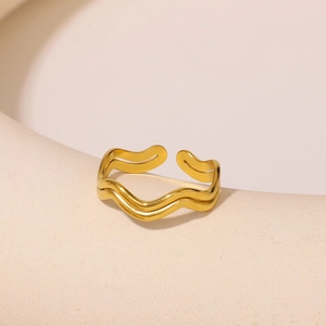 Minimalist gold wavy open ring for women with high-gloss metallic finish in warm studio light