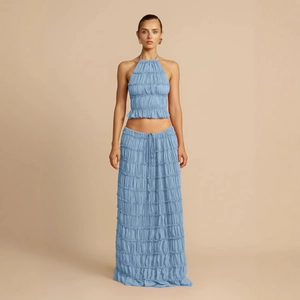 Sky blue halter top and tiered ruffle maxi skirt set with textured pleats