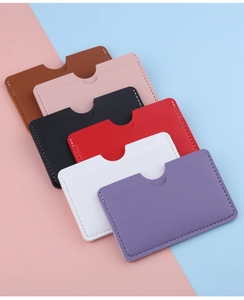 Slim leather card holders in six vibrant colors with precise stitching and easy-access top notch