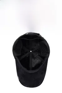 Detail of warm black men's baseball cap with plush faux fur lining and ear protection