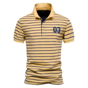 Detail of yellow and navy striped Polo shirt featuring number 03 patch and piqué texture