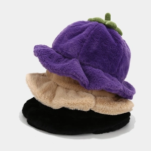 Cute pumpkin-shaped plush bucket hat in purple, beige and black colors with soft fur texture