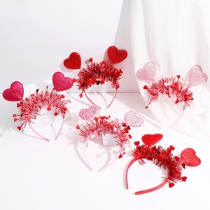 Detail of five sequin heart headbands in red and pink for Valentine's Day parties