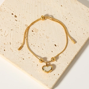 French vintage heart pendant bracelet with white shell in adjustable gold bead design