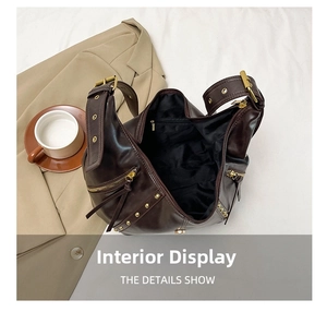 Detail showing the spacious black interior lining of the vintage oil wax leather tote bag