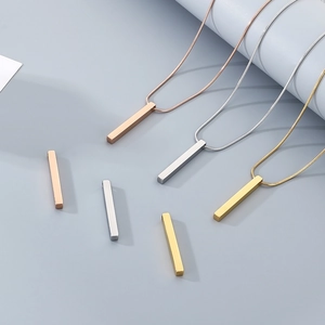 Detailed view of polished stainless steel bar pendants in rose gold, silver, and gold finish