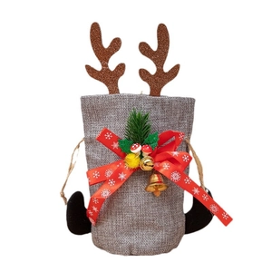 Grey linen Christmas gift bag with reindeer antlers, red bow and golden bell decoration