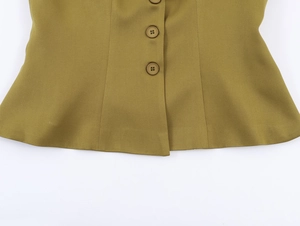 Detail of olive green blazer featuring classic four-hole buttons and a flared peplum hemline