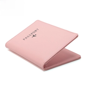 Pink RFID blocking travel passport holder with airplane logo on white background