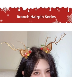 Close-up of a Christmas hair clip featuring brown reindeer antlers and mushroom detail