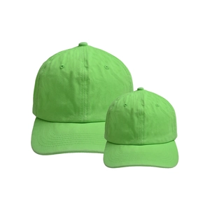 Matching neon green cotton baseball caps for parents and kids with curved brim and soft top
