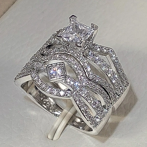 Elegant S925 silver ring set with princess cut zircon and brilliant pave diamonds