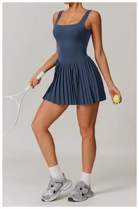 Dark blue tennis dress with square neck, pleated skirt and built-in shorts for active wear