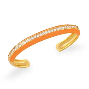 Bracciale rigido bohémien in smalto arancione con zirconi intarsiati e finitura oro