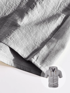 Detail of grey breathable linen fabric texture and drawstring on men's hooded short sleeve shirt