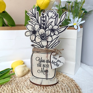 Detail of wooden flower ornament with You are THE BEST Mom engraving and heart tag
