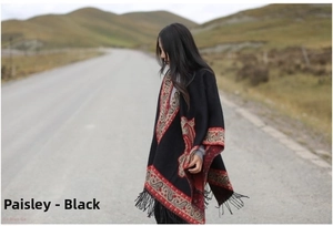Detailed view of bohemian black paisley shawl with delicate fringe tassels on the edge