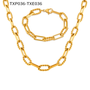 Detailed close-up of mixed geometric paperclip and twisted rope chain necklace set