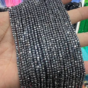 Close-up of faceted terahertz stone beads with metallic finish for jewelry making
