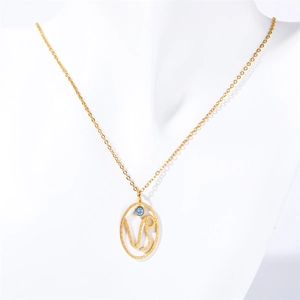 Detail of gold VIP pendant necklace with blue turquoise stone on white mannequin