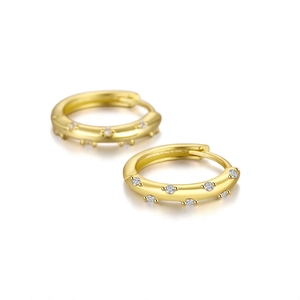 Close-up of S925 sterling silver wave hoop earrings with gold plating and zircons