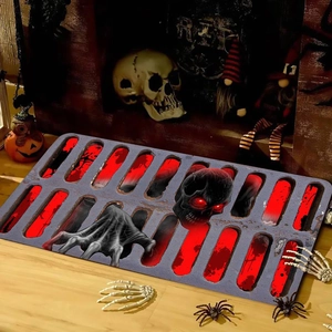 Detail of Halloween bath mat with skull print on light wood floor with festive props