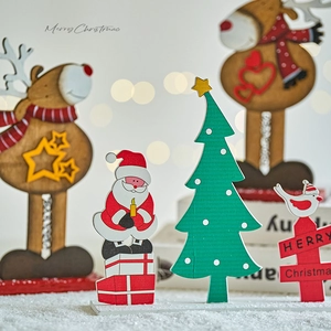 Handcrafted wooden Christmas tabletop ornaments featuring Santa and reindeer for home decor