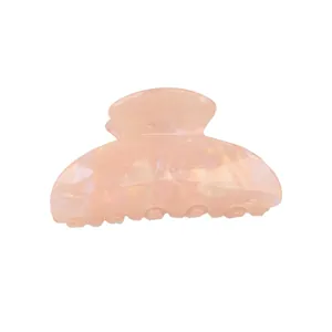 Pink pearlescent PVC claw clip with elegant shell texture and arched shark grip