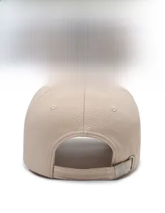 Detail view of adjustable metal buckle and breathable beige fabric on baseball cap