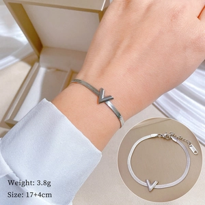 Detail of silver V-shaped pendant chain bracelet showing S.STEEL engraving and dimensions
