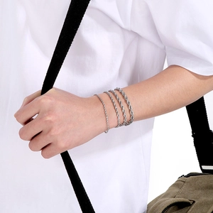 Detailed view of silver stainless steel twisted rope chain bracelets in various thicknesses
