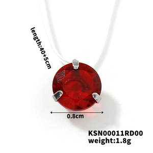 Detailed view of red round crystal pendant with precise 0.8cm three-claw setting