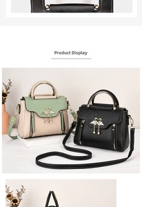 Detail of trendy crossbody bags with swan metal buckles and pearl pendants in two colors