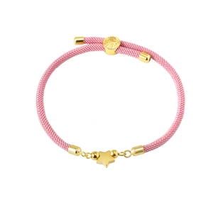 Detailed view of pink woven Milan cord bracelet with 18K gold star pendant and slider
