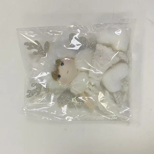 White plush Christmas angel ornament with silver wings in clear protective packaging