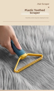 Detail of manual hair scraper removing lint from long-fiber carpets and rugs