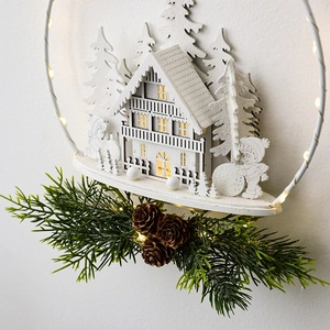 White Nordic wooden Christmas door hanger with reindeer castle scene and warm LED lights