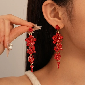 Luxurious long red rhinestone tassel earrings with a vintage gold floral drop design