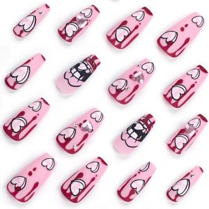 Pink heart press-on nails in coffin shape with rhinestones and y2k drip designs
