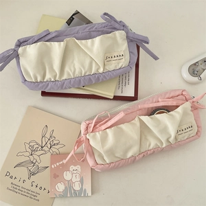 Quilted cotton pencil case with front dual pockets and stylish bow tie accents