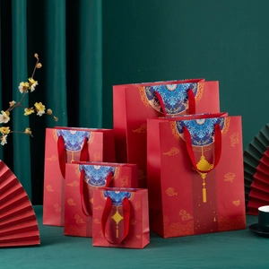 Chinese style red gift bags with gold cloud patterns and woven handles in five sizes