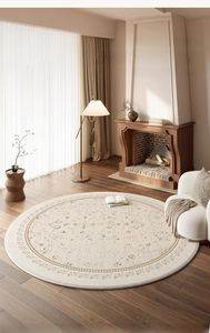 Detail of round beige French retro rug with elegant floral patterns in a cozy living room