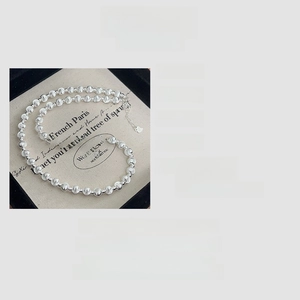 Macro detail of S925 silver cat eye bead necklace showing dimensions and 12g weight