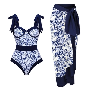 Blue floral one-piece swimsuit with matching sarong wrap skirt set for beach resort wear