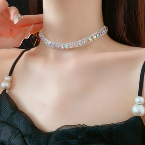 Detailed view of silver choker necklace featuring square and round rainbow gemstones