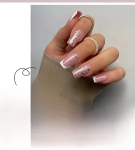 Detailed view of French press-on nails with white tips and silver glitter accents