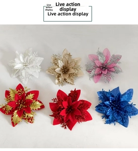 Detailed top view of six colorful glitter poinsettia flowers for Christmas tree decoration