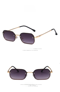Detail of metal sunglasses with twist-textured temples and grey gradient lenses